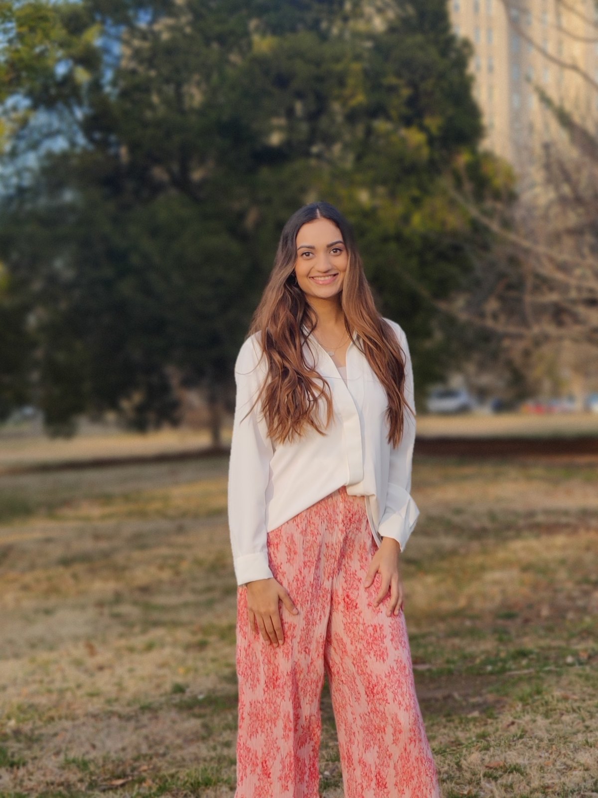 Shreeja Vachhani, LMSW — a portrait taken outdoors in warm afternoon light